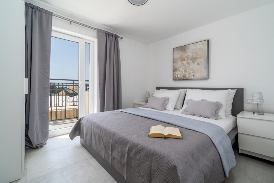 Bedroom No1 (12sqm) with a king size bed 180cm x 200cm,  A/C, amazing sea views and an exit toward the balcony and South terrace