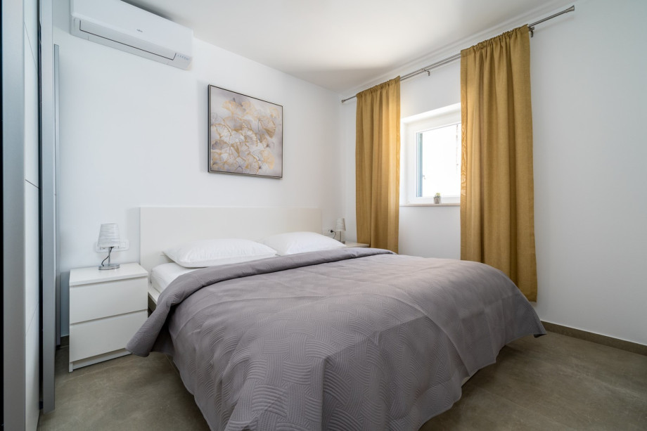 Bedroom No4 (12sqm) with a king size bed 180cm x 200cm, air-condition and sew views.