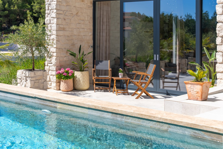 Relax by the privat pool of this stunning stone villa.
