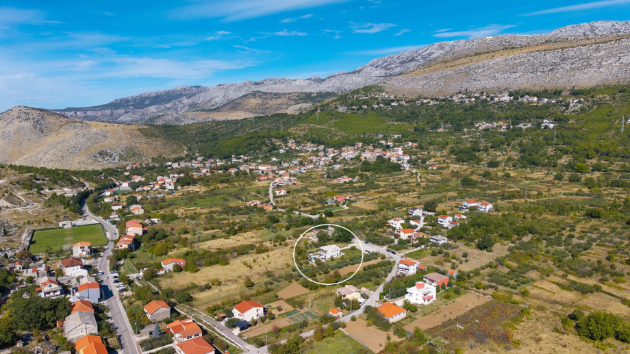 Aerial view of Villa Agrosa nestled in a calm rural area, offering a quiet holiday experience.