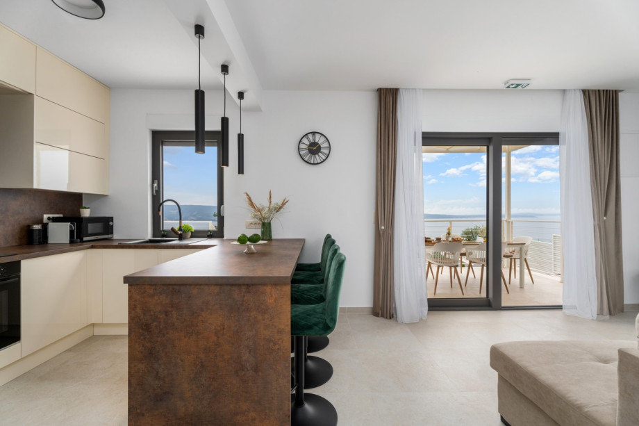 The kitchen island has all the amenities a modern guest needs.