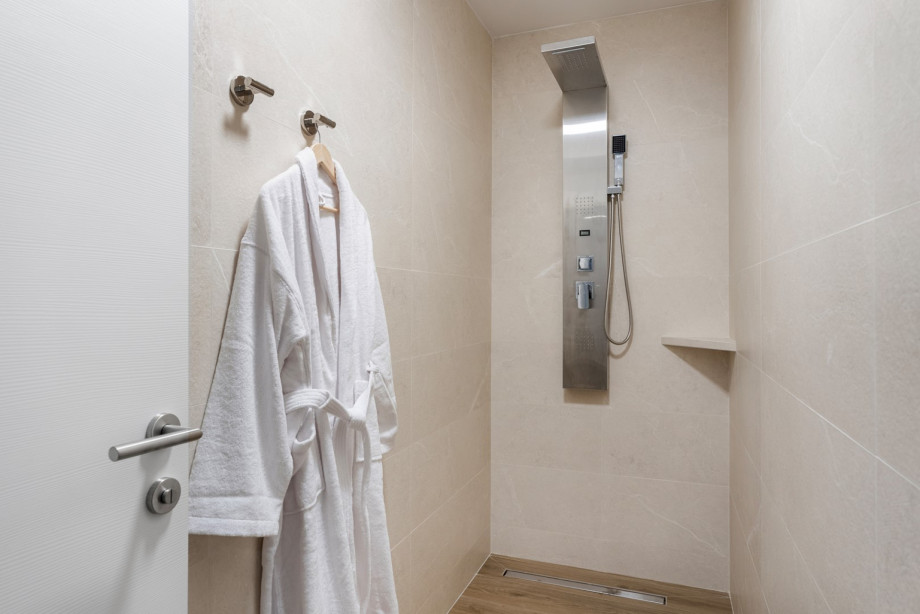 Gym with air conditioning, a shower, weights, yoga and pilates equipment