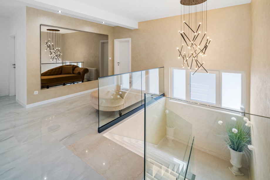 Spacious staircases and very nicely decorated hallways leading to the bedrooms