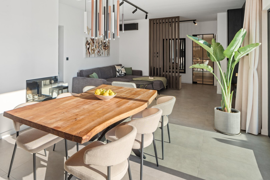 The chic, air-conditioned living room with the contemporary dining table for gathering up to 6 guests.