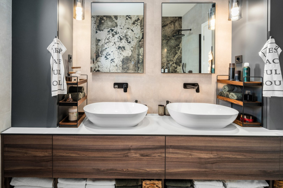 En-suite bathroom in the Master Bedroom featuring double sinks and storage space.