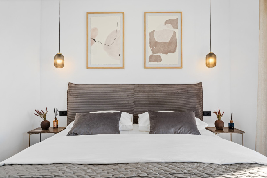 Bedroom 2, featuring another inviting king-size bed (180 cm x 200 cm) and stylish decor.