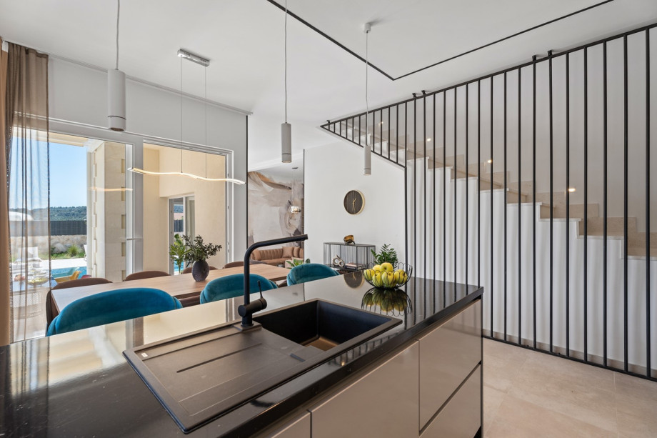 The kitchen island has all the amenities a modern guest needs.