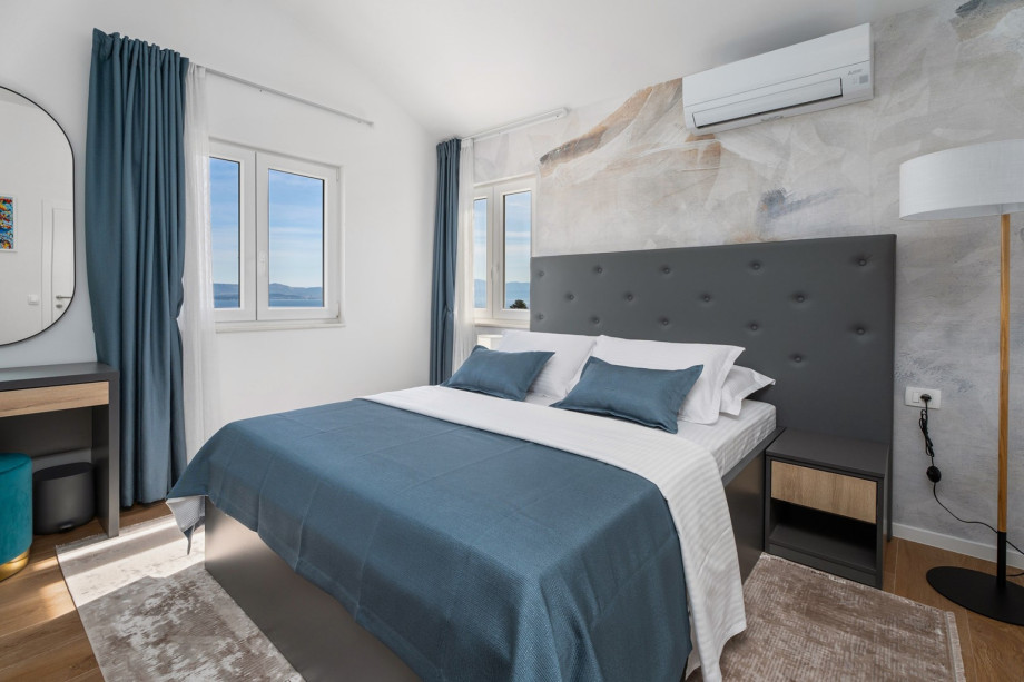 Bedroom NO4  with an A/C, a TV, an en-suite bathroom, and a sea view