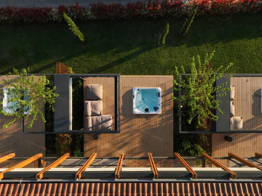 Aerial view of the outdoor area showing the three private terraces, each with its own whirlpool and lounge.