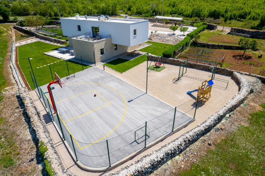 Table tennis and foosball table right next to the outdoor dining area