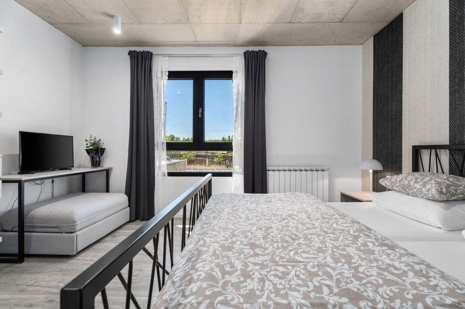 Bedroom NO1 with king size bed 180x200cm + a sofa bed for 1 person 90x200cm, TV, A/C,bath