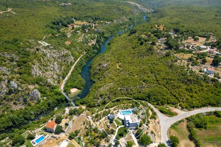 Aerial view showing the property and its proximity to the river.