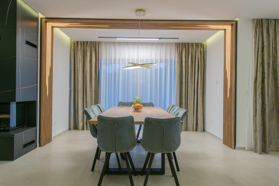 Stylish dining area with a table and elegant lighting.