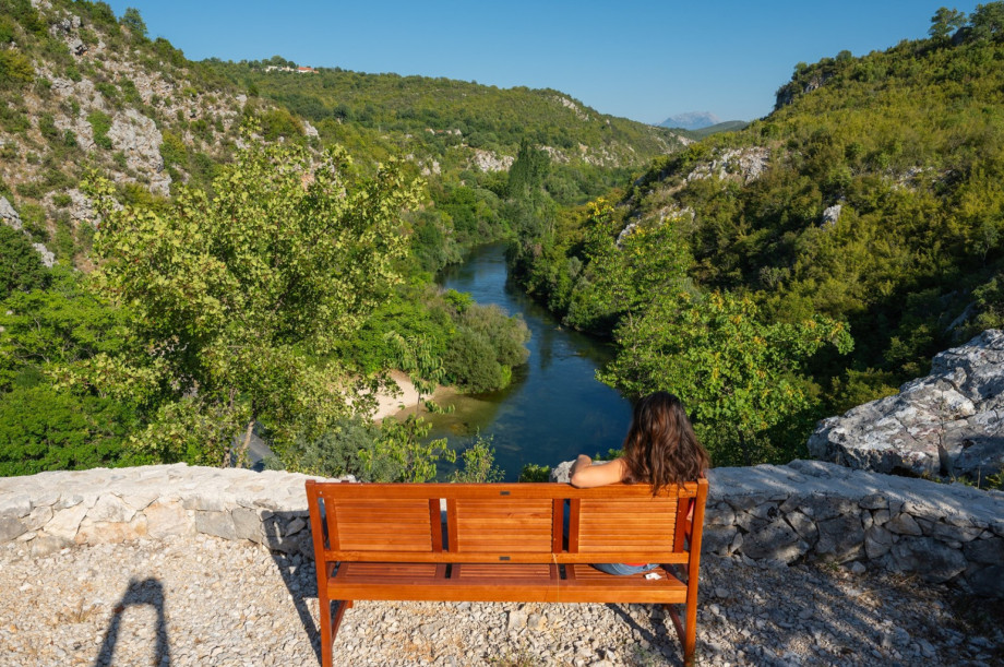 A wooden bench on the private plot offers spectacular views of the nearby Cetina River.