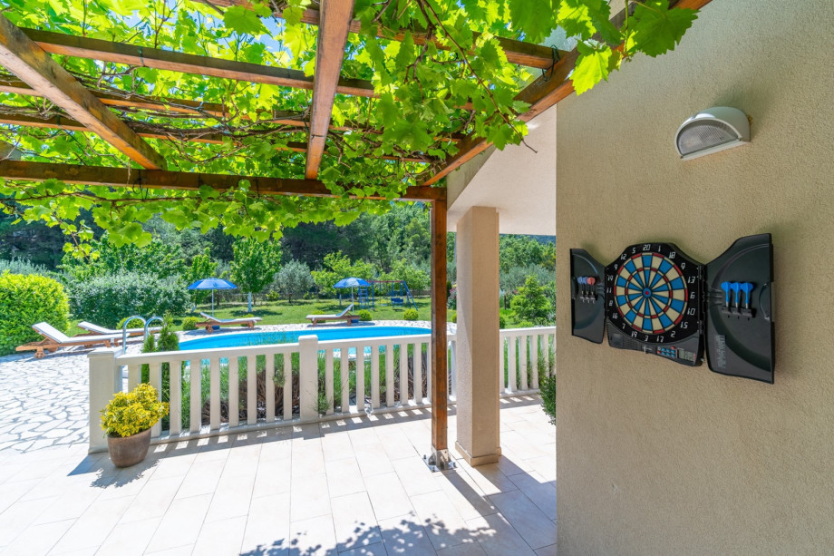 Outdoor area with dart and table tennis