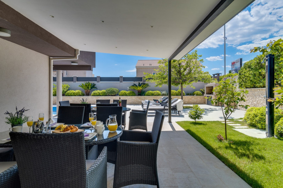 Private pool and garden with covered outdoor furniture for 14 people