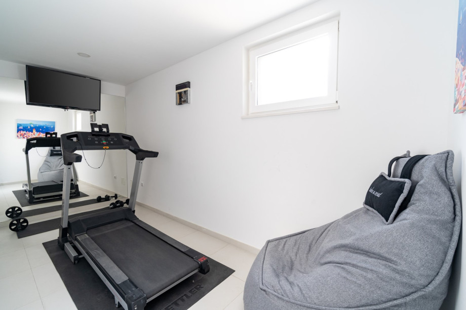 Room with a running trail and TV