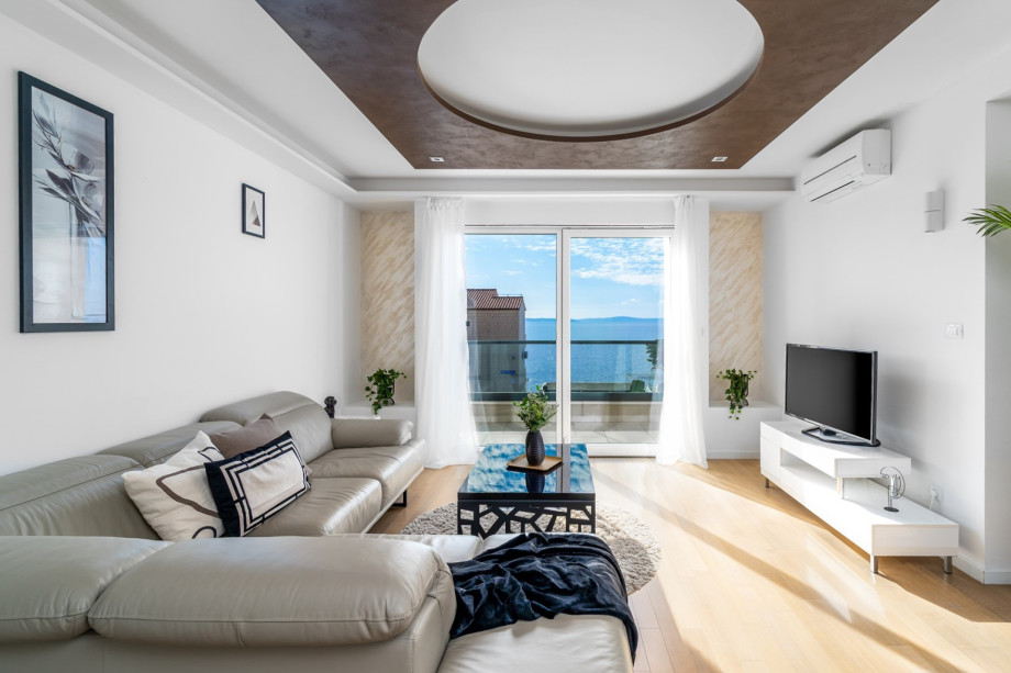 Living and dining area in an apartment on the 1st floor with open sea view