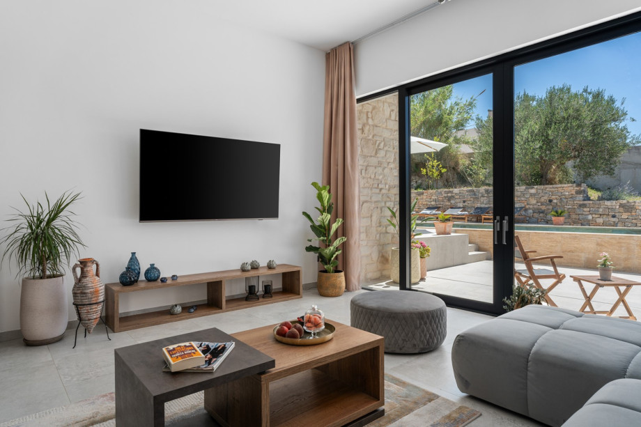 Indoor ground floor offers an air-conditioned dining area for 8 with exit toward outdoor dining area