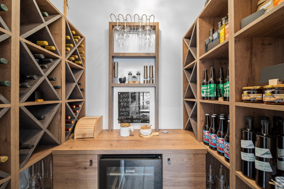 Vine cellar next to the kitchen with a great selection of vine