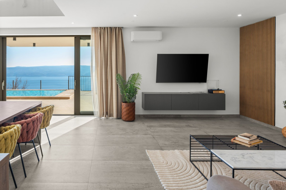 Modern living room featuring a comfortable sofa and panoramic views.