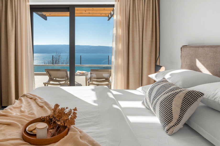 Modern en-suite bedroom with direct sea and Island Brač views.