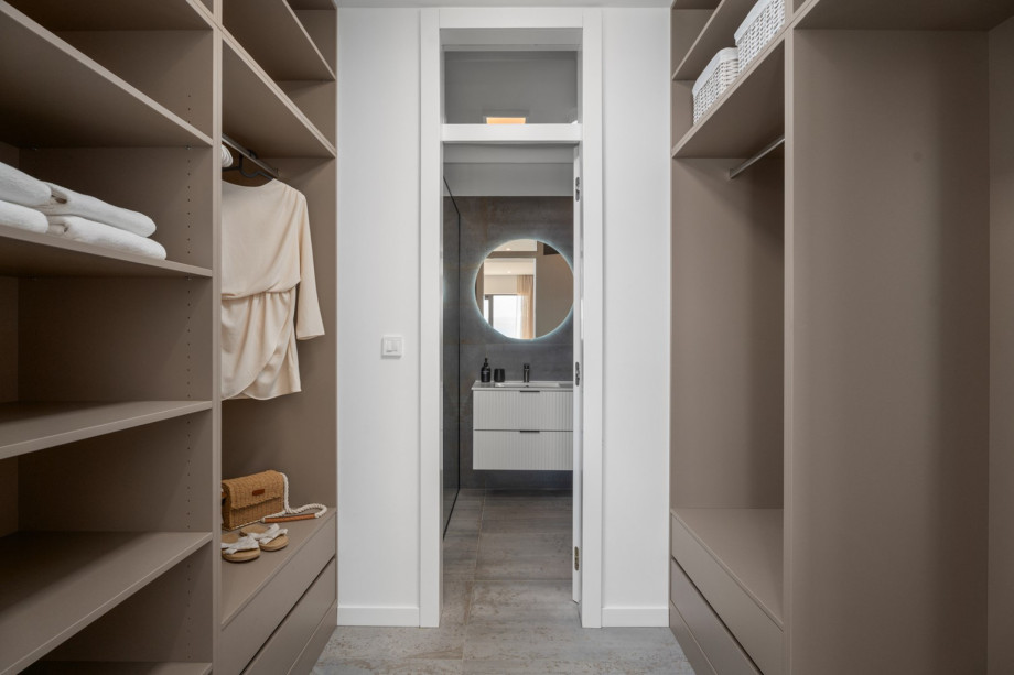 Walk-in wardrobe designed to provide a stylish environment and extra convenience.
