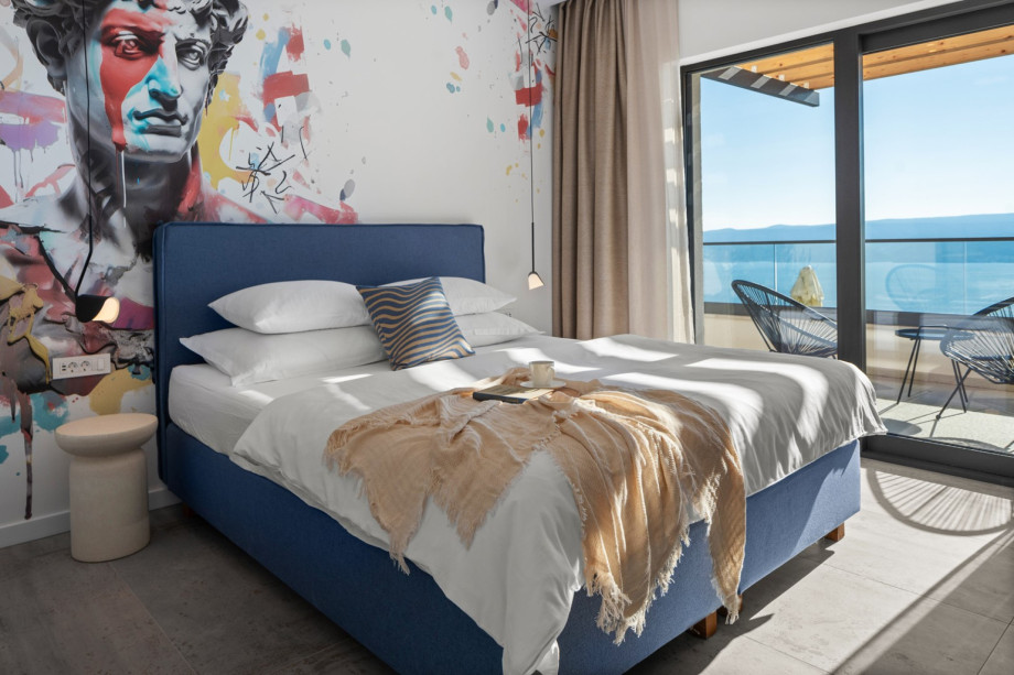 Spacious en-suite bedroom overlooking the coastline.