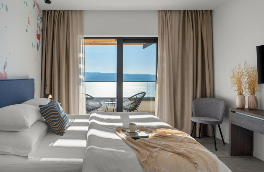 Modern bedroom featuring a smart TV and a private en-suite bathroom.