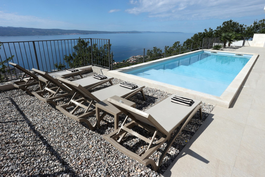 Eight comfortable lounge chairs await on the sun deck for ultimate relaxation overlooking the Adriatic.