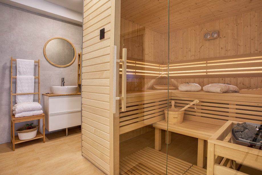 a spa room with Finnis Sauna, Gym with Bluetooth surround system and shower