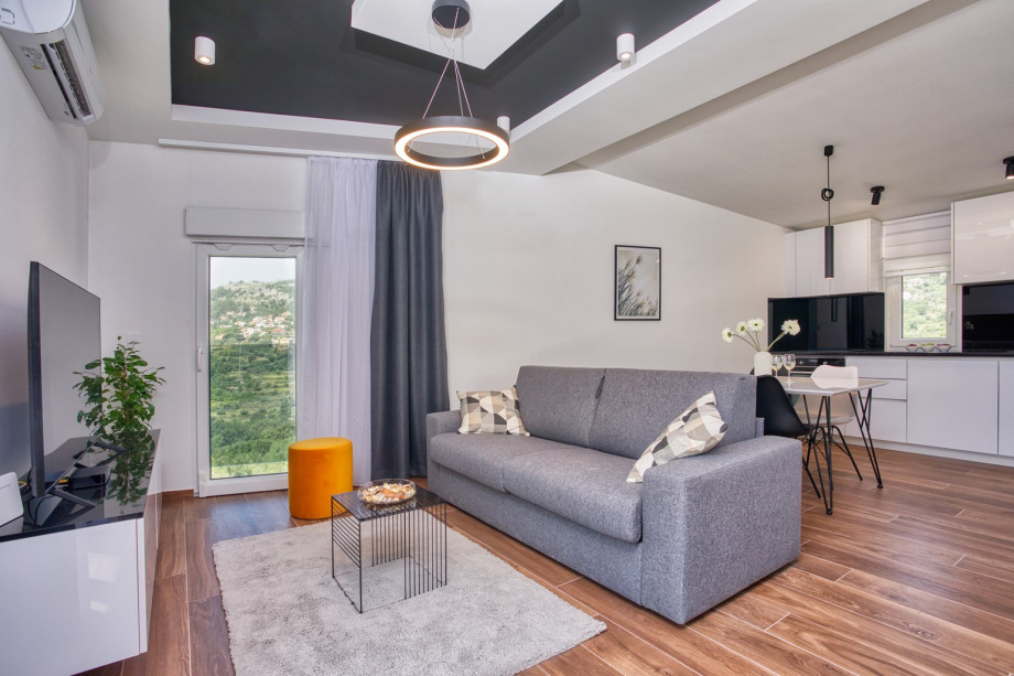 a fully equipped kitchen, dining area, a living room with a sofa (that converts into a sofa bed), TV, free WiFi, A/C