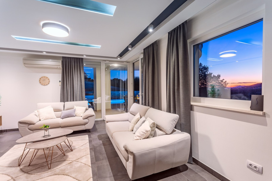 spacious living area with exit to pool