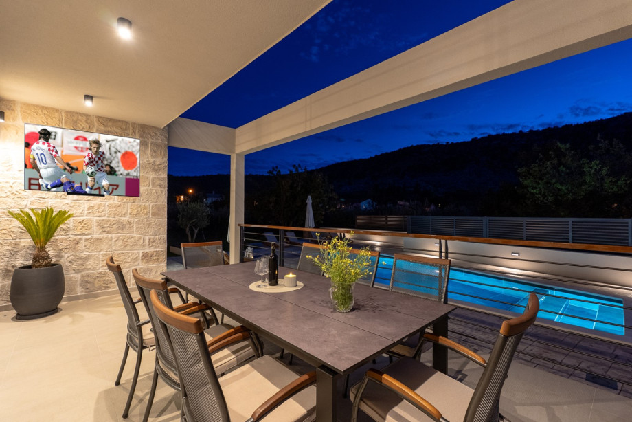 Covered outdoor dining area with a dining table, BBQ (grill/charcoal), and a sink will be next to the pool.