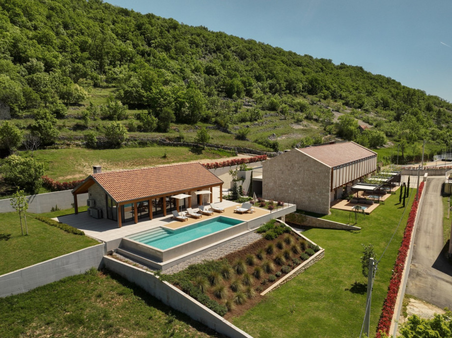 An aerial perspective of Villa Terra Moro, showing the elegant stone architecture and lush Dalmatian setting.