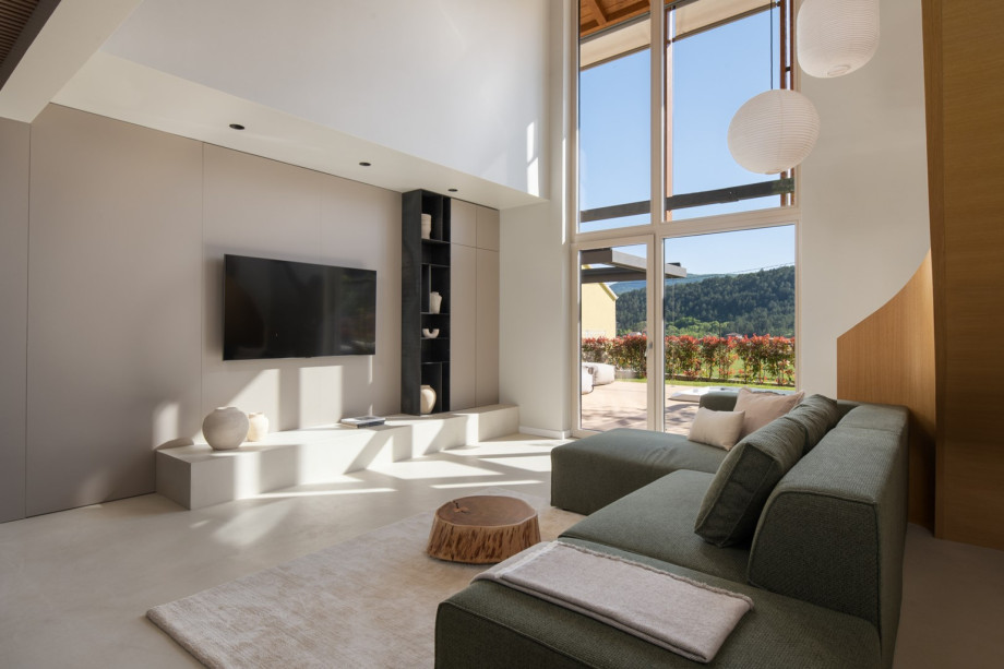 Modern elegance meets traditional charm in this spacious living room, featuring high-quality furnishings.