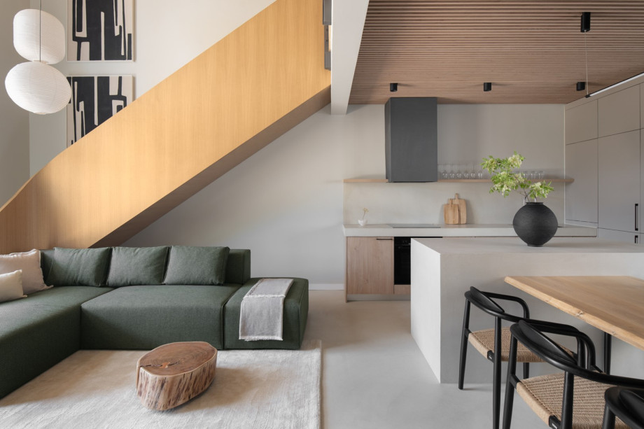 A fully equipped modern kitchen featuring top-of-the-line appliances and a wine cooler for culinary needs.