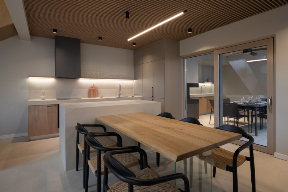 Fully equipped kitchen featuring top-of-the-line appliances and a spacious indoor dining area.