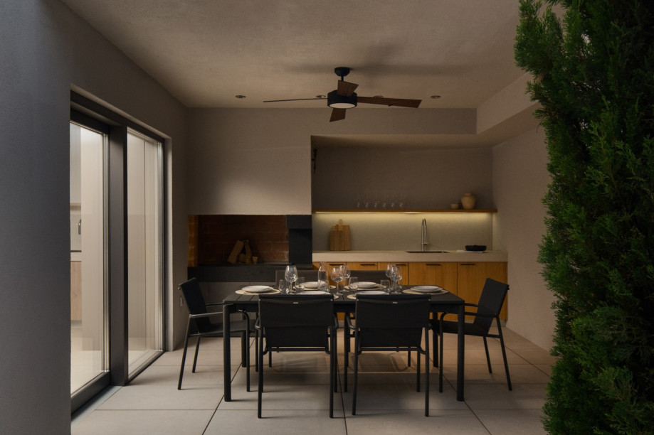 Covered terrace with a summer kitchen and dining area, perfect for group entertaining and al fresco meals.