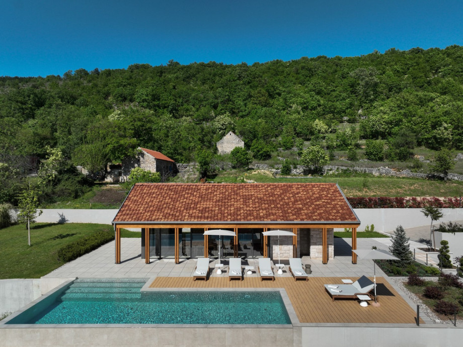 Experience the ultimate escape with this expansive 70 sqm heated pool and sun-drenched lounge deck.