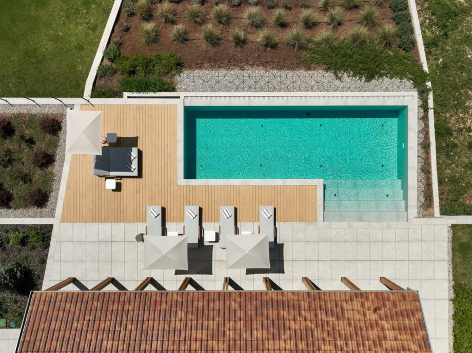 Aerial view of the generous 70 sqm private heated pool featuring a skin-gentle electrolytic system.