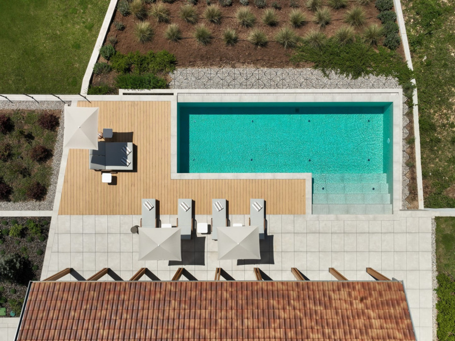 Aerial view of the generous 70 sqm private heated pool featuring a skin-gentle electrolytic system.