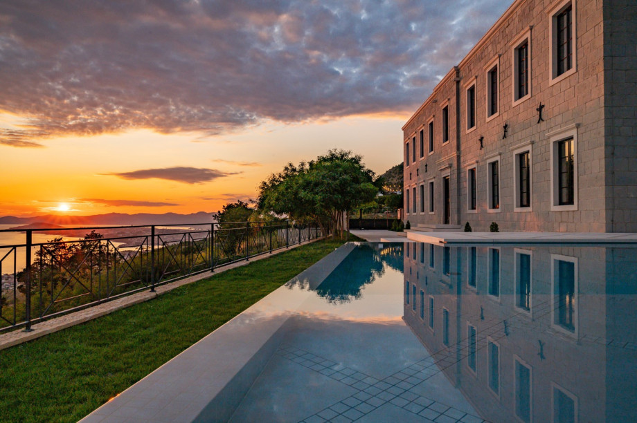 Experience unmatched comfort while enjoying spectacular sea views from the heated infinity pool at sunset.