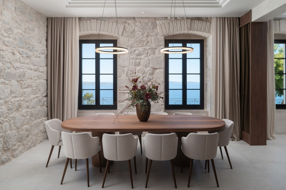 Dine indoors at this elegant table while enjoying breathtaking views of the Adriatic Sea and islands.