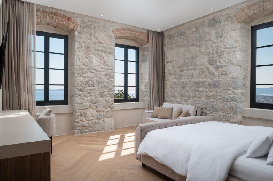 This spacious bedroom includes a King-size bed and a sofa bed.