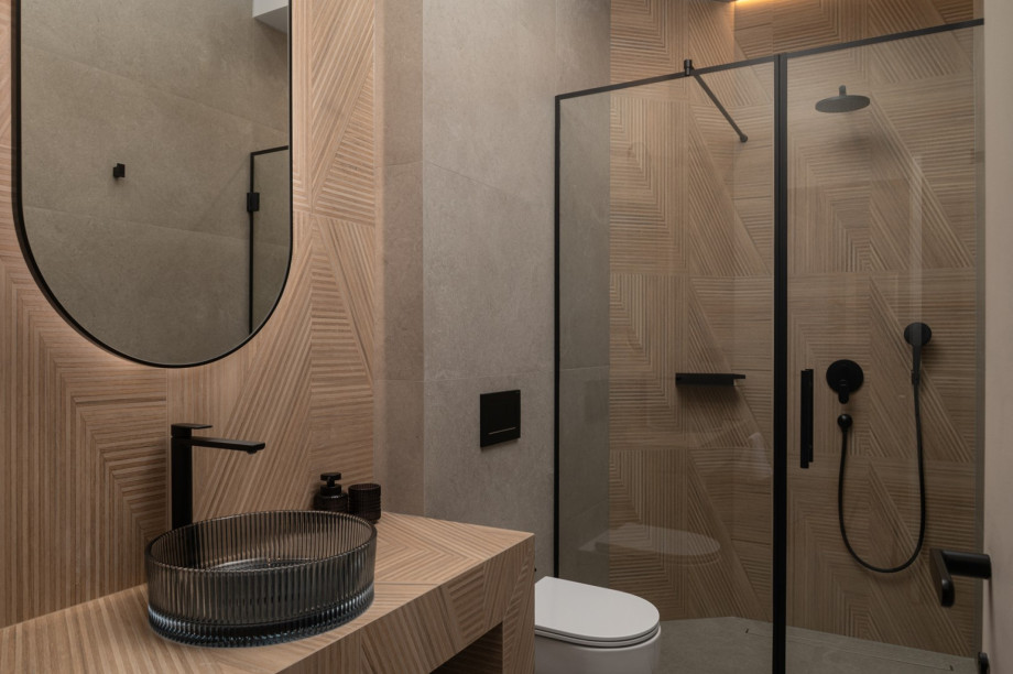 The en-suite bathroom combines modern comfort with traditional Mediterranean charm and luxury decor.