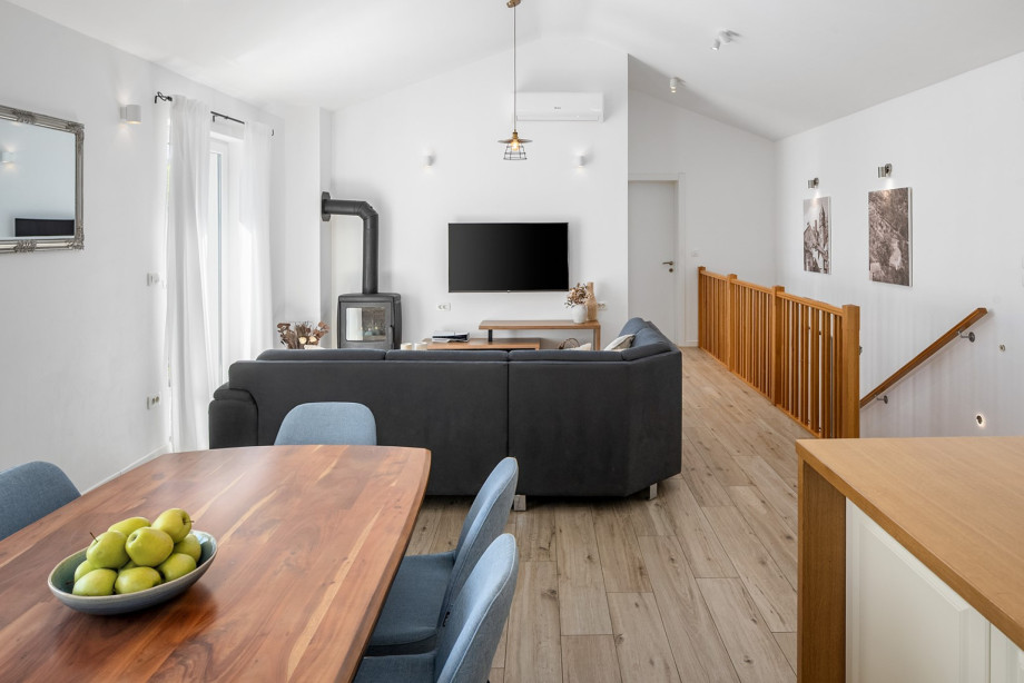 Kitchen and a living room, with an AC, PS 5 and a fireplace