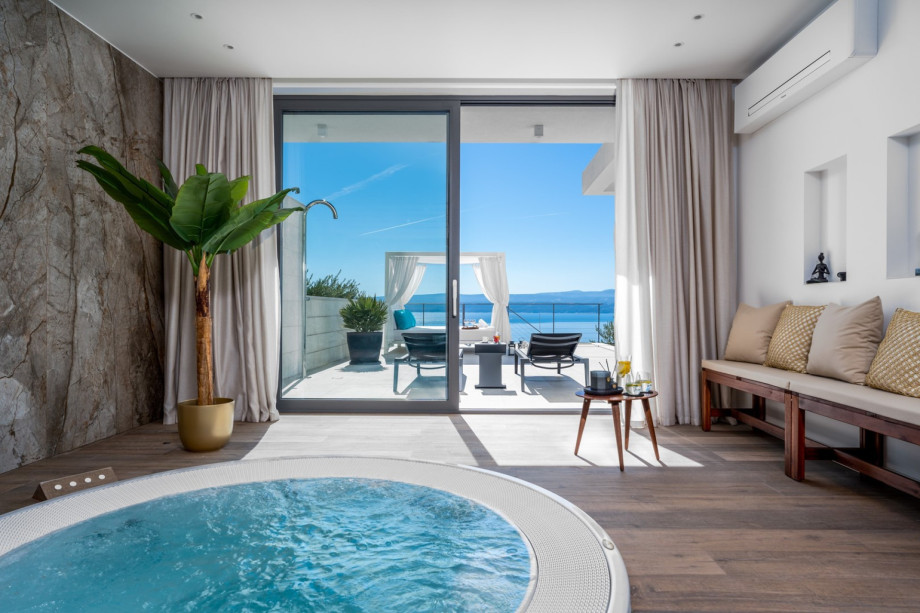 The pool area can be directly approached from the Spa.