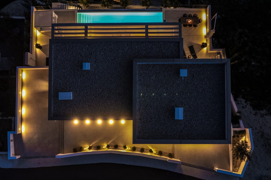 There is also an outdoor staircase from the parking lot down to the ground floor level – the pool area.