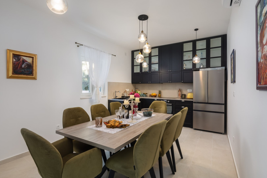 Adjacent is the fully equipped kitchen, complete with modern appliances